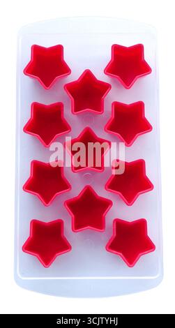 Empty red silicone star molds in a transparent tray isolated on white Stock Photo