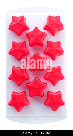 Empty red silicone star molds in a transparent tray isolated on white Stock Photo