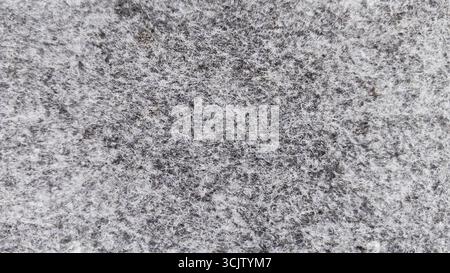 Grey abstract fibrous background, texture of felt fabric. Stock Photo