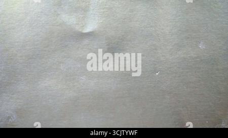 Iridescent silver foil paper texture, abstract festive background with pastel colors Stock Photo