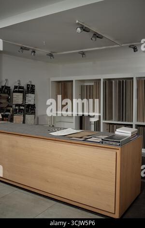 Modern Interior Design Studio Displaying Material Samples on Wooden Counter Stock Photo