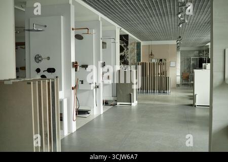 Modern Bathroom Showroom Displaying Contemporary Shower Fixtures and Tiles Stock Photo