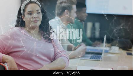 Working woman viewing conference room table, using laptops and digital padlock overlay, copy space Stock Photo