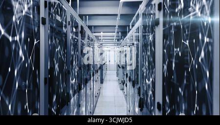 Data center aisle stretching between glass-doored server racks, with overhead cable trays Stock Photo