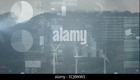 Rotating three turbines displaying pie charts and line graph overlays on misty hilltop wind farm Stock Photo