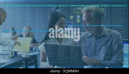 Collaborating mature woman and man analyzing code on laptop at modern operations center, dashboards Stock Photo