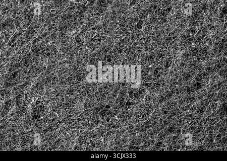 Dark abstract background and pattern of interwoven hairs, fibers and nanofibers. Sponge detail texture, sponge texture close up background. Cellulose Stock Photo