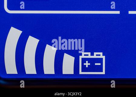 Close up of blue digital display on uninterruptible power supply with automatic voltage stabilizer Stock Photo