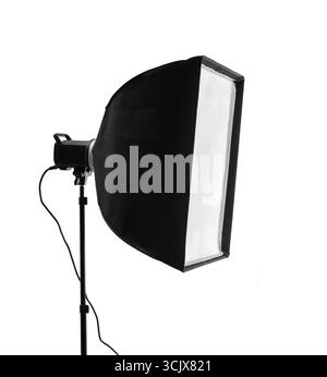 A professional photographic studio flash with a rectangular softbox mounted on a stand Stock Photo
