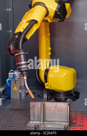 Automated Welding Torch Robot Arm Metal Beam Workshop Fabrication Stock Photo