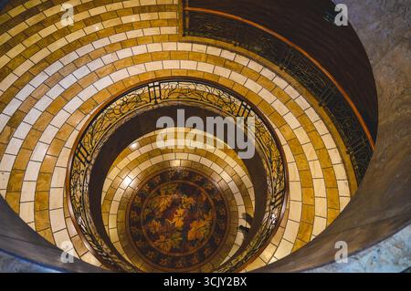 Spiral marble staircase with mosaic floor in Parnitha, Greece. Stock Photo