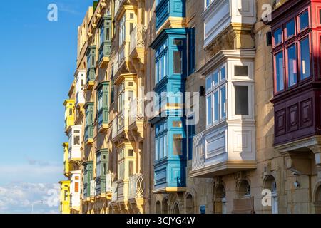 Amazing historic houses with colorful wooden balconies in La Valletta, capital city of Malta Stock Photo