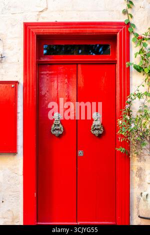 Wooden red doors in La Valletta, capital city of Malta Stock Photo