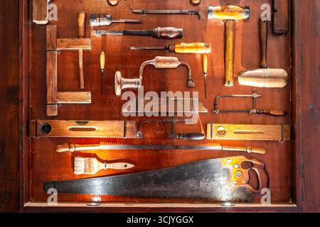 Plenty of different carpenter's tools exhibited and illuminated in the museum, Malta Stock Photo