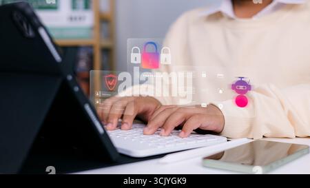 Businessman typing on laptop with cybersecurity icons, data protection, and AI technology interface, concept of digital security, privacy, and online Stock Photo