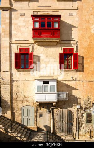 Amazing, wonderful historic houses with red wooden balconies in La Valletta, capital city of Malta Stock Photo
