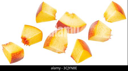 Falling peach cubes isolated on white background with clipping path, fresh nectarine slices Stock Photo