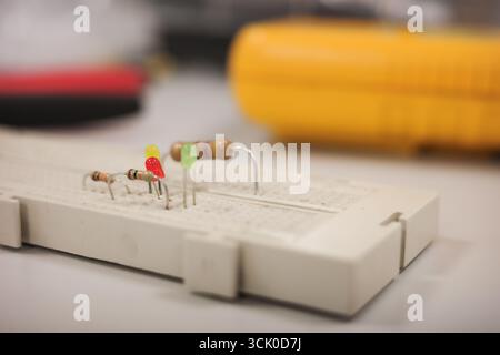 Electronic breadboard with resistors and LED components Stock Photo