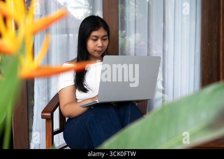 Close up of woman using laptop outdoor Stock Photo