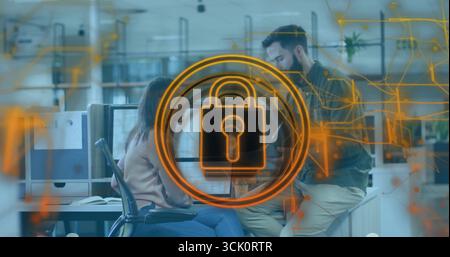 Displaying glowing orange padlock icon circling network circuits in office, data security theme Stock Photo