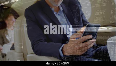 Tapping bearded executive man in suit using tablet in aircraft cabin, with encryption overlays Stock Photo