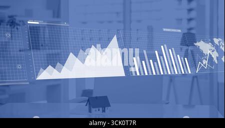 Displaying semi-transparent line, bar and map panels over office desk, featuring mini house model Stock Photo