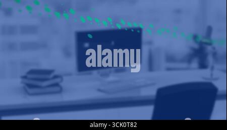 Displaying widescreen computer monitor and keyboard on desk in front window, with green data points Stock Photo