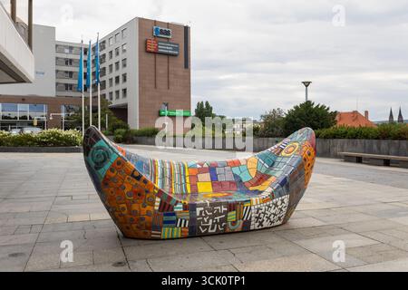 Colorful, mosaic-covered public bench with geometric and abstract patterns by Czech artist Alexandra Koláčková - Prague, Czech Republic Stock Photo