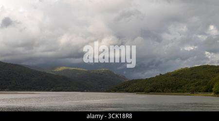 View of rainclouds over the Mawddach estuary. From the Mawddach trail  between Dolgellau and Barmouth, Gwynedd, Wales. July. Stock Photo