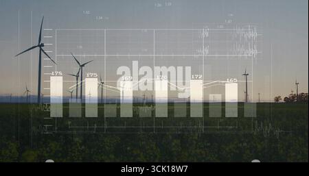 Displaying white bar chart and overlaid line graph over rural farmland at dusk, with wind turbines Stock Photo
