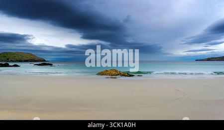 Achmelvich Lochinver Sutherland Scotland dark sky sea and sand of Vestey's Beach Stock Photo