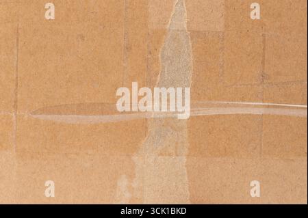 Brown paper with transparent tape on it close up view background Stock Photo