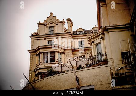 Historic cream building with balconies and windows Stock Photo