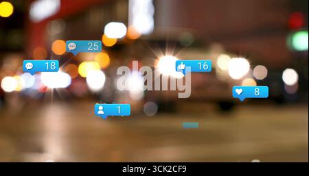 Floating blue notification icons over blurred city street at night, showing social media counts Stock Photo