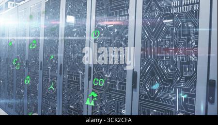 Displaying circuit patterned server cabinets lining data center aisle, neon green floating icons Stock Photo