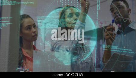 Three professionals collaborating on code in conference room, with glass board and globe graphic Stock Photo