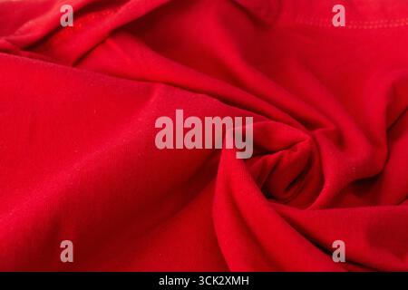 Close-up Red twisted fabric texture, Crumpled red fabric background. Stock Photo