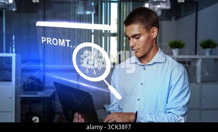 Young man working with laptop in modern office while exploring artificial intelligence applications Stock Photo
