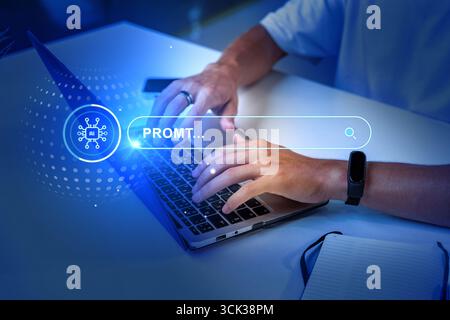Person typing on a laptop with digital search interface during a creative work session in a modern workspace Stock Photo