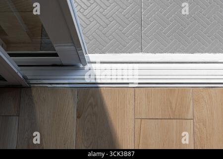 Corroded or damaged rollers cause stuck sliding door.  Replace Sliding Glass Door Rollers concept Stock Photo