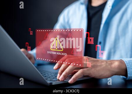 System hacked alert warning on laptop screen with red unlocked padlock icons, cyber attack, data Stock Photo