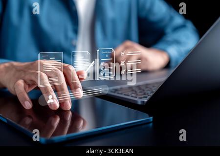 Document planning, task checklist, certification, and workflow management. digital tablet and laptop Stock Photo