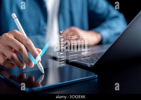 Digital checklist on tablet for task planning, productivity management, online forms, paperless Stock Photo