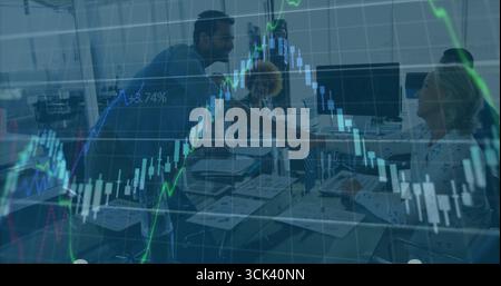 Shaking hands among business team while reviewing financial charts at office meeting, with laptops Stock Photo