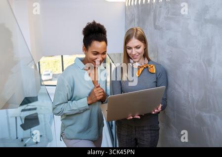 Mixed team of software engineers brainstorming ideas. Diverse app developers collaborating as group Stock Photo