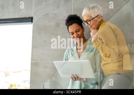 Group of business professionals having a meeting to discuss ideas and solutions for finance company Stock Photo