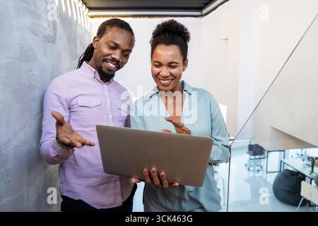 Mixed team of software engineers brainstorming ideas. Diverse app developers collaborating as group Stock Photo