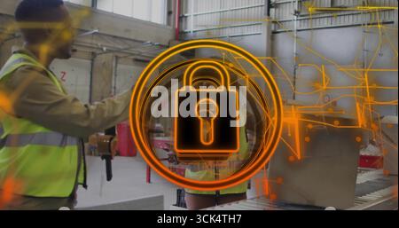 Workers wearing vests scanning boxes with scanner on warehouse conveyor belt, with glowing padlock Stock Photo