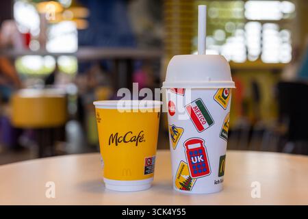 Kerpen, Germany - August, 9, 2025: McCafe and McDonalds drink cups on table in restaurant Stock Photo