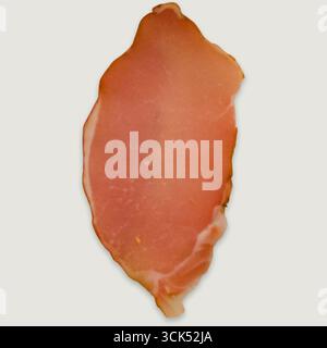 A slice of cured meat, showcasing its delicate texture and color. Stock Photo